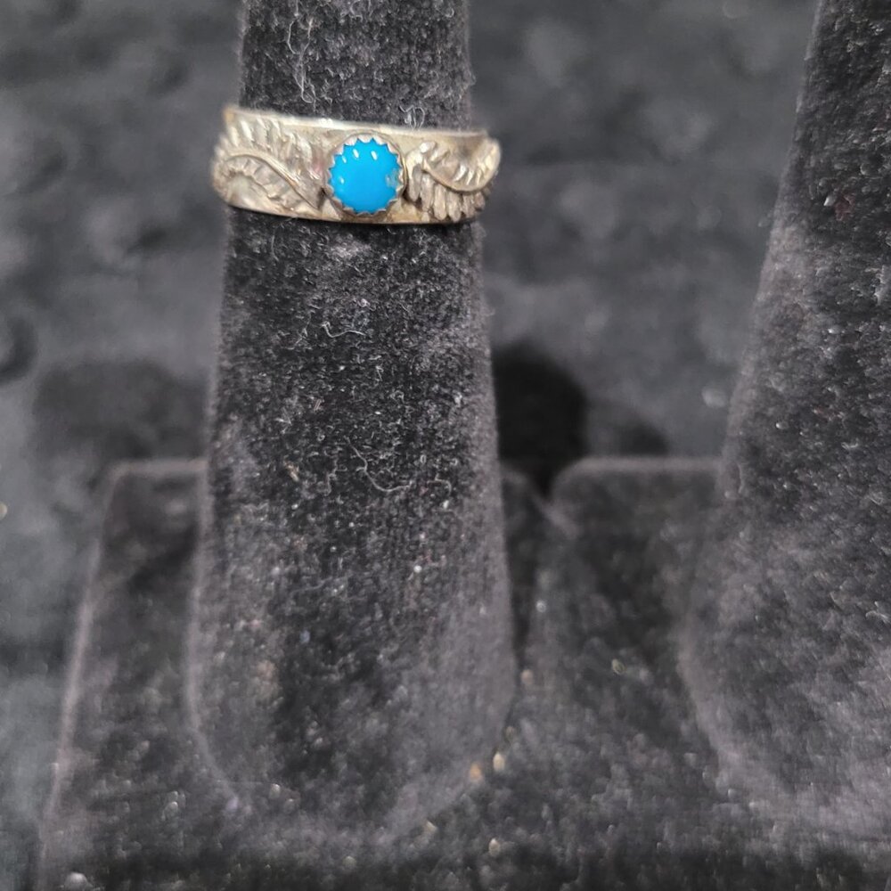 Item #Q280  Sterling Silver Small Turquoise center stone Ring size 6.25